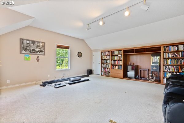 15395 SW Emerald St, Beaverton, OR 97007 - exercise area with lofted ceiling, track lighting, carpet floors, and baseboards