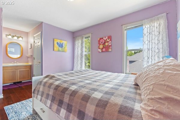 15395 SW Emerald St, Beaverton, OR 97007 - bedroom featuring dark wood-style floors, ensuite bathroom, and a sink