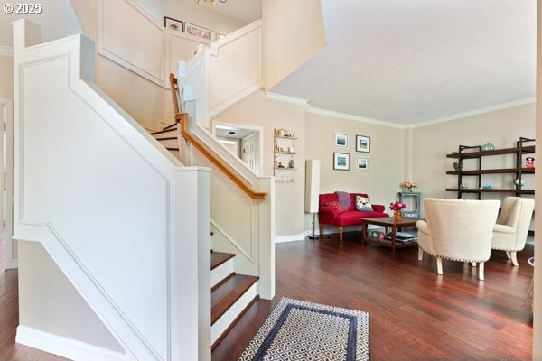 15395 SW Emerald St, Beaverton, OR 97007 - staircase featuring wood finished floors, ornamental molding, and baseboards