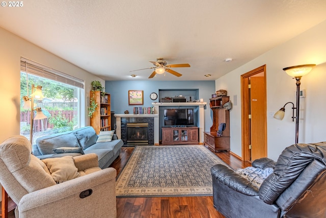 428 SE 11th Cir, Troutdale, OR 97060 - living area with wood finished floors, a tiled fireplace, and ceiling fan