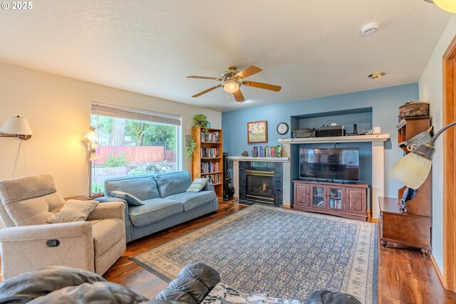 428 SE 11th Cir, Troutdale, OR 97060 - living room with a ceiling fan, a premium fireplace, and wood finished floors