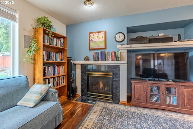 428 SE 11th Cir, Troutdale, OR 97060 - living room featuring wood finished floors and a tiled fireplace