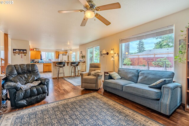 428 SE 11th Cir, Troutdale, OR 97060 - living area with light wood finished floors, plenty of natural light, and a ceiling fan