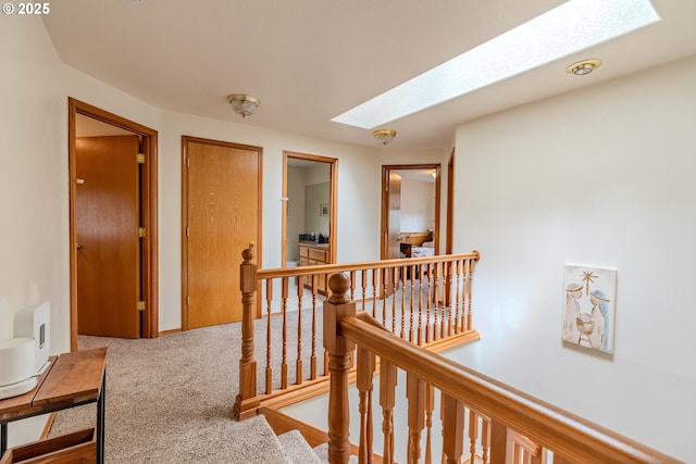 428 SE 11th Cir, Troutdale, OR 97060 - hallway featuring a skylight, an upstairs landing, and carpet floors