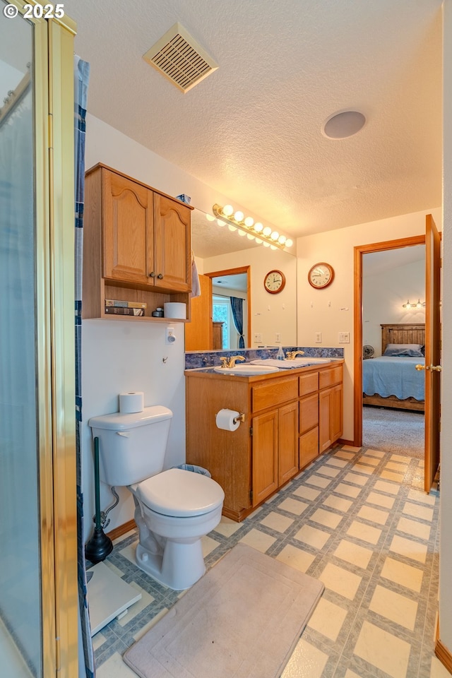 428 SE 11th Cir, Troutdale, OR 97060 - ensuite bathroom featuring double vanity and a textured ceiling