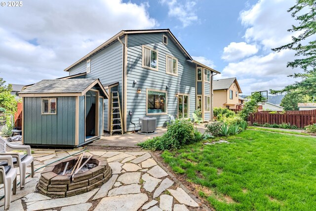 428 SE 11th Cir, Troutdale, OR 97060 - back of property featuring a fire pit, a patio area, and a storage unit