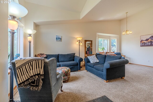 428 SE 11th Cir, Troutdale, OR 97060 - living area featuring high vaulted ceiling, carpet, and a chandelier