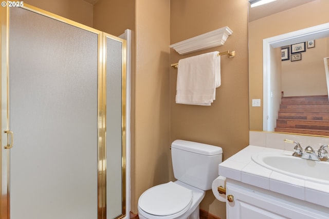 full bath with a shower stall, toilet, and vanity