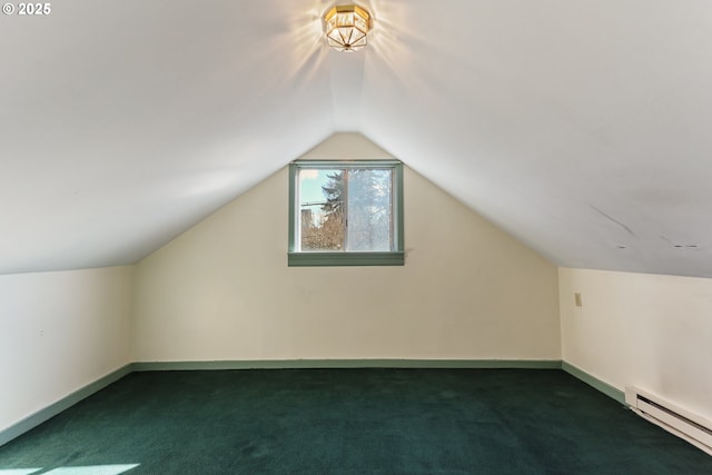 additional living space featuring a baseboard radiator, lofted ceiling, and dark colored carpet