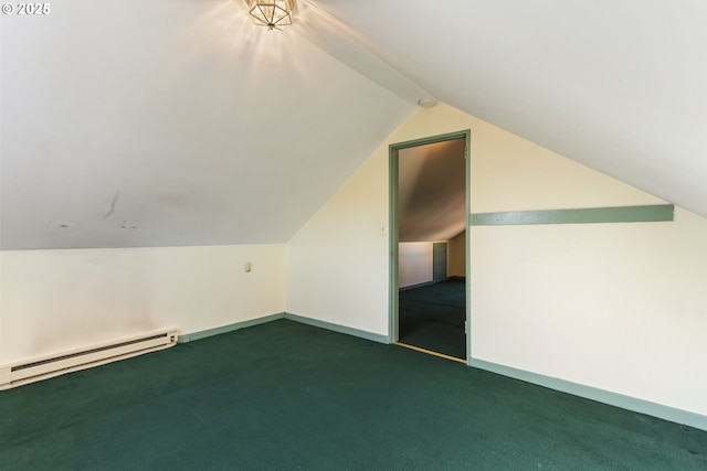 additional living space featuring vaulted ceiling, dark carpet, and baseboard heating