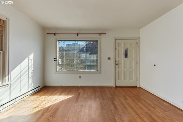 entryway with a baseboard radiator and light hardwood / wood-style floors