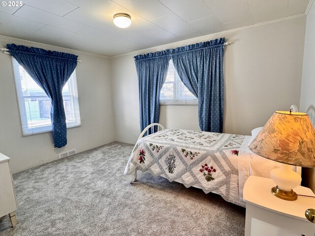 bedroom featuring carpet floors and ornamental molding