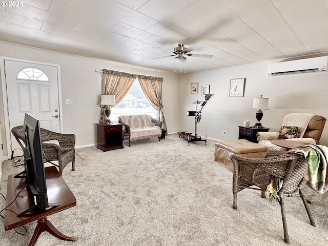 sitting room with ceiling fan, carpet flooring, and a wall mounted AC