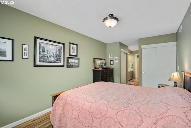 6600 SE Division St Unit 304, Portland, OR 97206 - bedroom with baseboards and wood finished floors