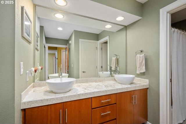 6600 SE Division St Unit 304, Portland, OR 97206 - full bathroom featuring double vanity and a sink