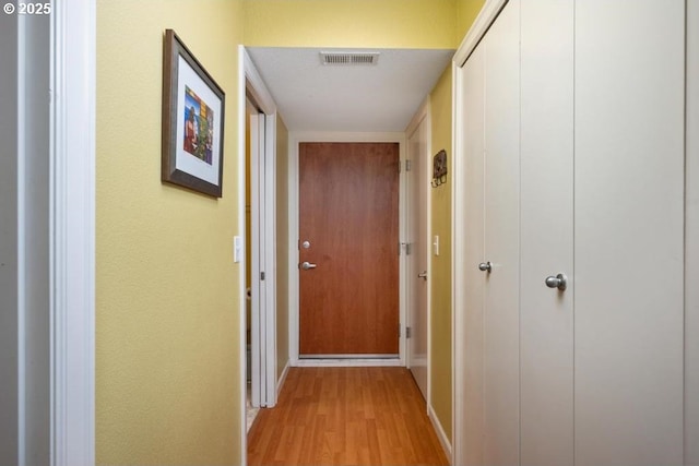 6600 SE Division St Unit 304, Portland, OR 97206 - hallway featuring visible vents, light wood finished floors, and baseboards