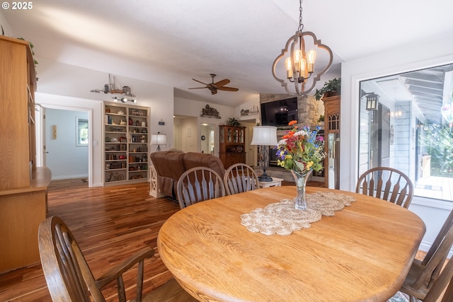 5 Woodthrush Ln, Gleneden Beach, OR 97388 - dining room featuring a chandelier, wood finished floors, lofted ceiling, ceiling fan, and baseboards