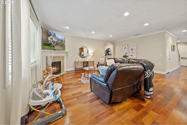 12647 SW 21st Ct, Lake Oswego, OR 97035 - living area with recessed lighting, ornamental molding, a premium fireplace, and light wood finished floors