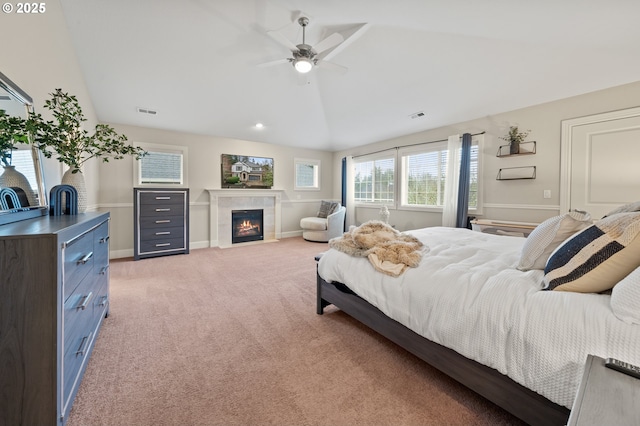 12647 SW 21st Ct, Lake Oswego, OR 97035 - bedroom featuring multiple windows, light carpet, a tile fireplace, vaulted ceiling, and ceiling fan