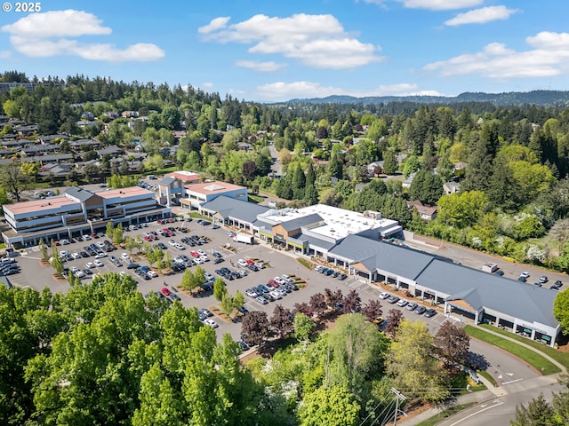 aerial view with a wooded view