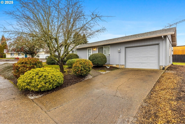 ranch-style house with driveway and an attached garage