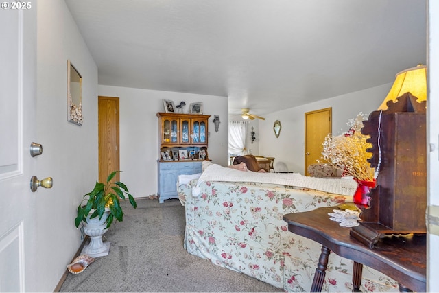 interior space with carpet floors and a ceiling fan