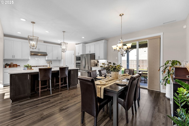2625 NE 8th Ave, Battle Ground, WA 98604 - dining space featuring a chandelier, dark wood-style flooring, and recessed lighting
