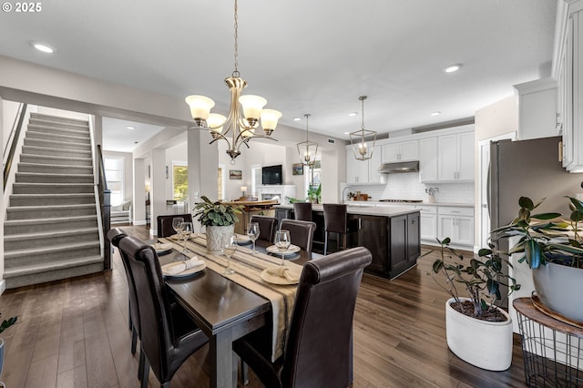 2625 NE 8th Ave, Battle Ground, WA 98604 - dining room featuring a chandelier, dark wood-style flooring, stairs, and recessed lighting