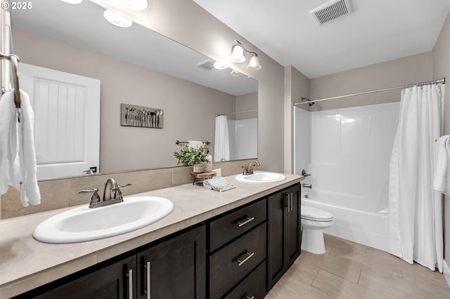 2625 NE 8th Ave, Battle Ground, WA 98604 - full bath with double vanity, shower / bath combo, toilet, and tile patterned floors