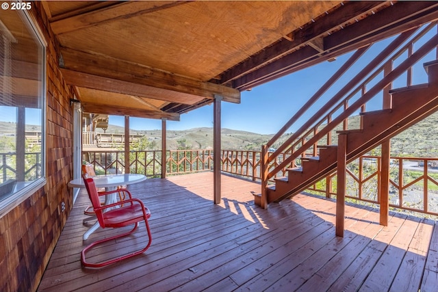 deck featuring stairway and a mountain view