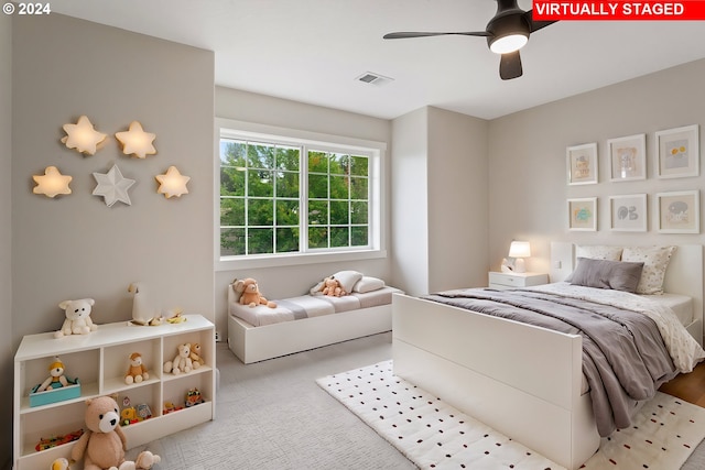 carpeted bedroom with ceiling fan