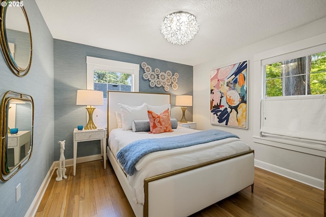 364 Northshore Rd, Lake Oswego, OR 97034 - bedroom featuring wallpapered walls, hardwood / wood-style flooring, and a textured ceiling