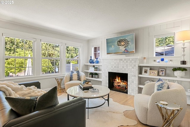 364 Northshore Rd, Lake Oswego, OR 97034 - living room with wood finished floors, plenty of natural light, and a brick fireplace
