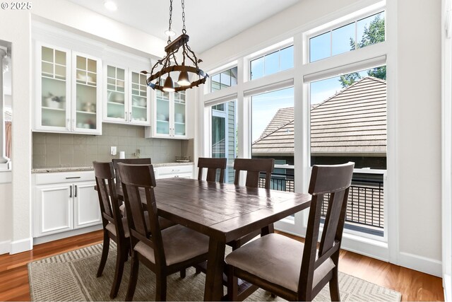 17488 SW Hoodoo Ct, Beaverton, OR 97007 - dining space with light wood-style flooring, a chandelier, baseboards, and recessed lighting