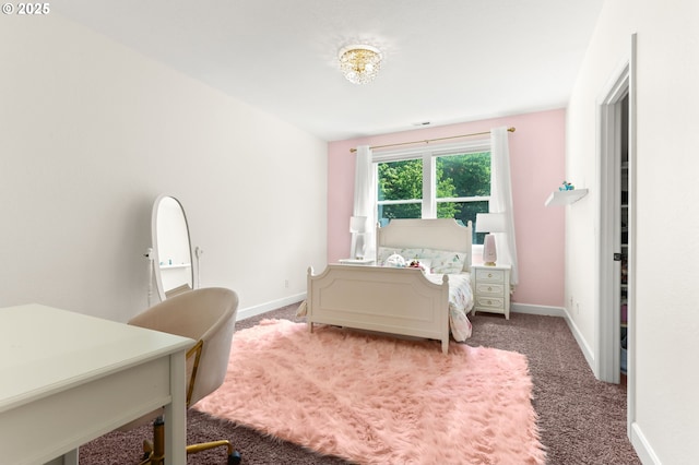 bedroom with light carpet and baseboards