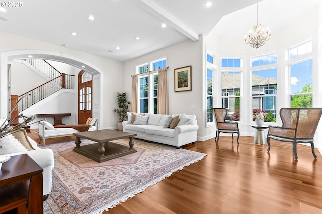 17488 SW Hoodoo Ct, Beaverton, OR 97007 - living room with wood finished floors, arched walkways, baseboards, a chandelier, and recessed lighting