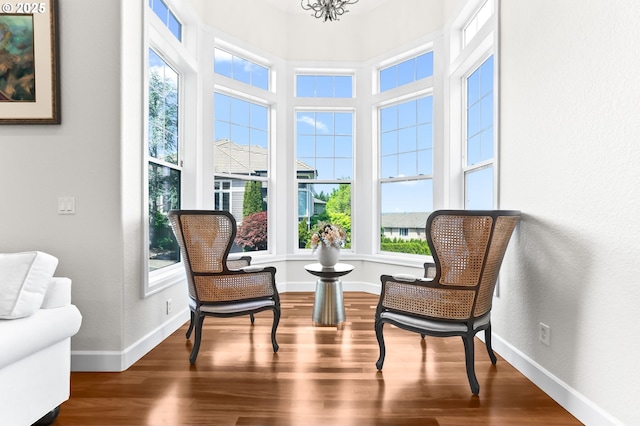 17488 SW Hoodoo Ct, Beaverton, OR 97007 - sitting room featuring wood finished floors, baseboards, a chandelier, and a textured wall