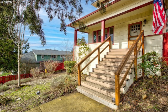 entrance to property featuring a porch