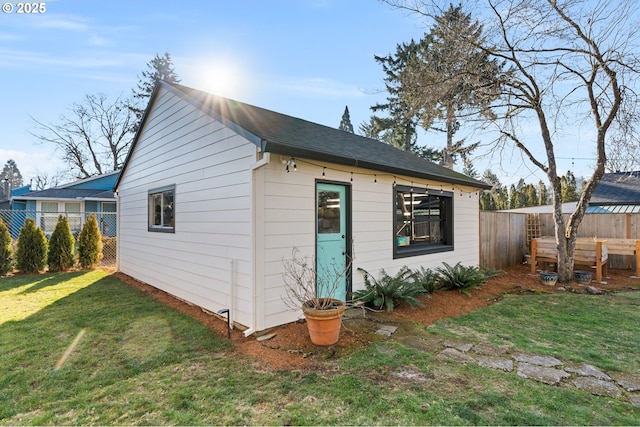 view of outbuilding with a lawn