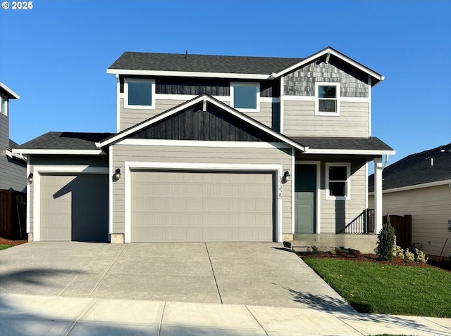 1596 N Millican Creek St, Lafayette, OR 97127 - view of front of home featuring an attached garage, concrete driveway, a front lawn, and roof with shingles