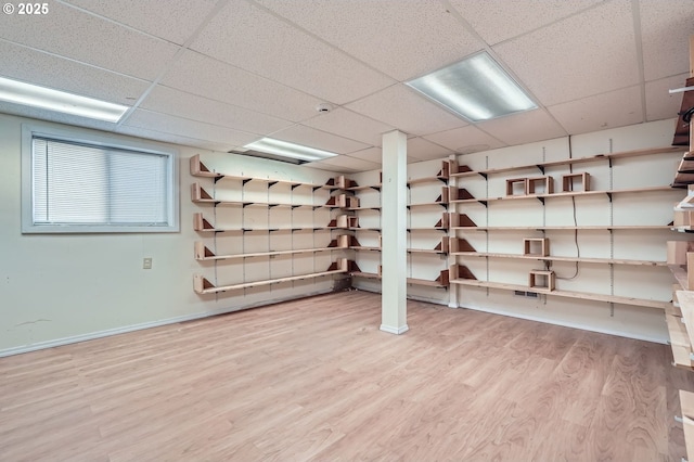 1207 NE 2nd Cir, Battle Ground, WA 98604 - basement with baseboards, a drop ceiling, and wood finished floors