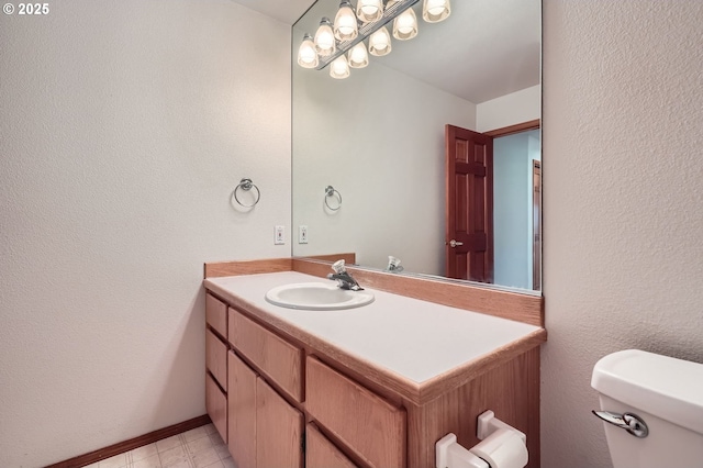 1207 NE 2nd Cir, Battle Ground, WA 98604 - bathroom with toilet, vanity, baseboards, and a textured wall