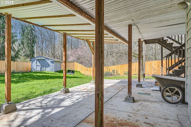 1207 NE 2nd Cir, Battle Ground, WA 98604 - view of patio / terrace featuring a shed, a fenced backyard, and an outdoor structure