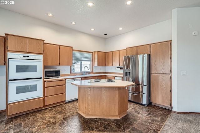 1207 NE 2nd Cir, Battle Ground, WA 98604 - kitchen with recessed lighting, a center island, light countertops, stainless steel appliances, and a sink