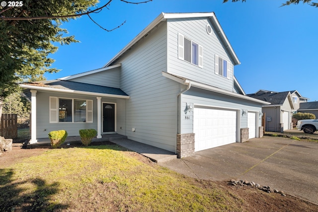 view of front of home with a garage and a front lawn