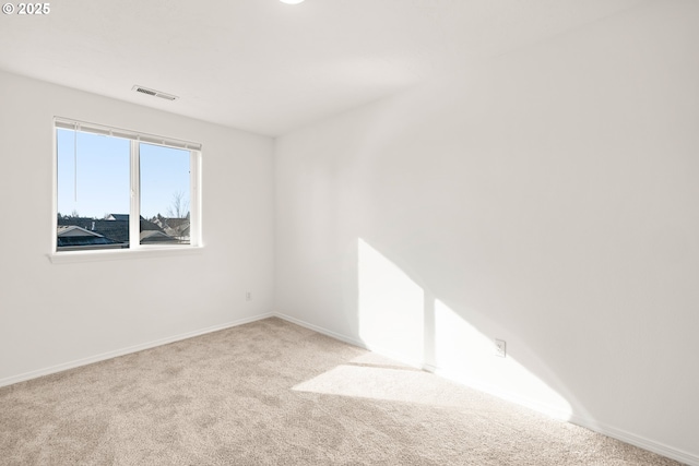 spare room with light carpet