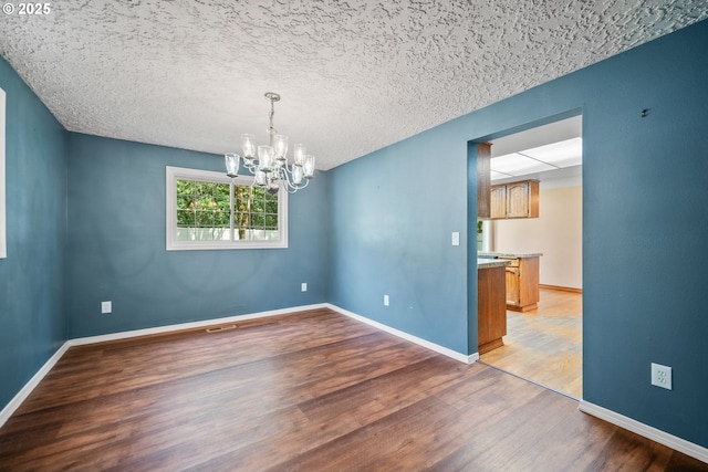 5807 NE 152nd Ave, Vancouver, WA 98682 - unfurnished room featuring a chandelier and light wood-style flooring