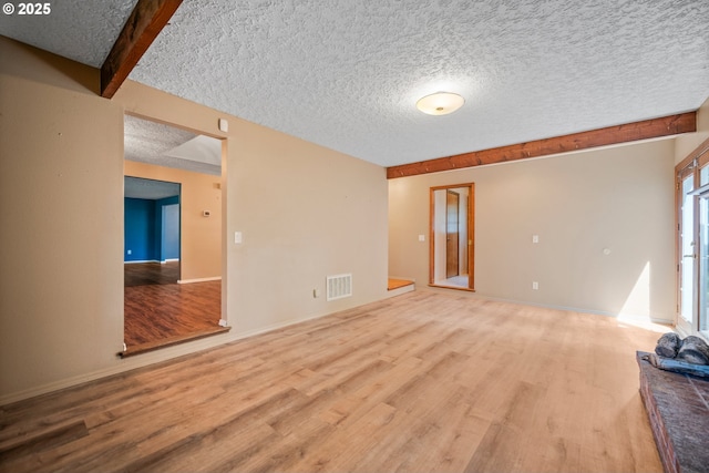 5807 NE 152nd Ave, Vancouver, WA 98682 - unfurnished living room featuring wood finished floors and a textured ceiling