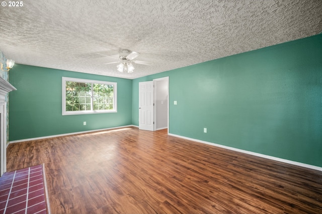 5807 NE 152nd Ave, Vancouver, WA 98682 - unfurnished bedroom featuring wood finished floors, a fireplace, ceiling fan, and a textured ceiling