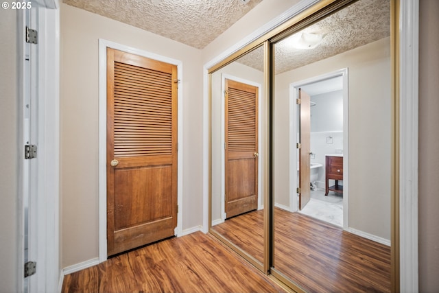 5807 NE 152nd Ave, Vancouver, WA 98682 - corridor featuring wood finished floors and a textured ceiling